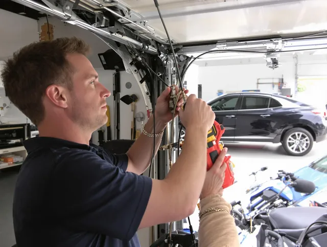 Gahanna Garage Door Repair safety certified technician performing cable replacement in Gahanna
