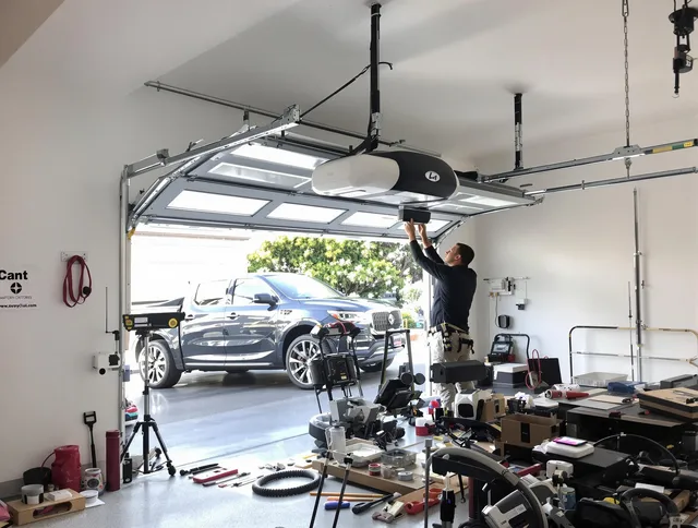 Gahanna Garage Door Repair specialist installing smart garage door opener system in Gahanna home