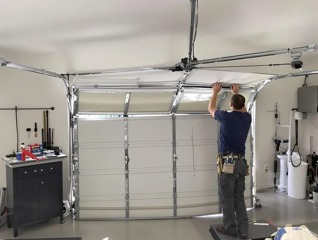 Gahanna Garage Door Repair specialist performing precise section replacement on Gahanna garage door